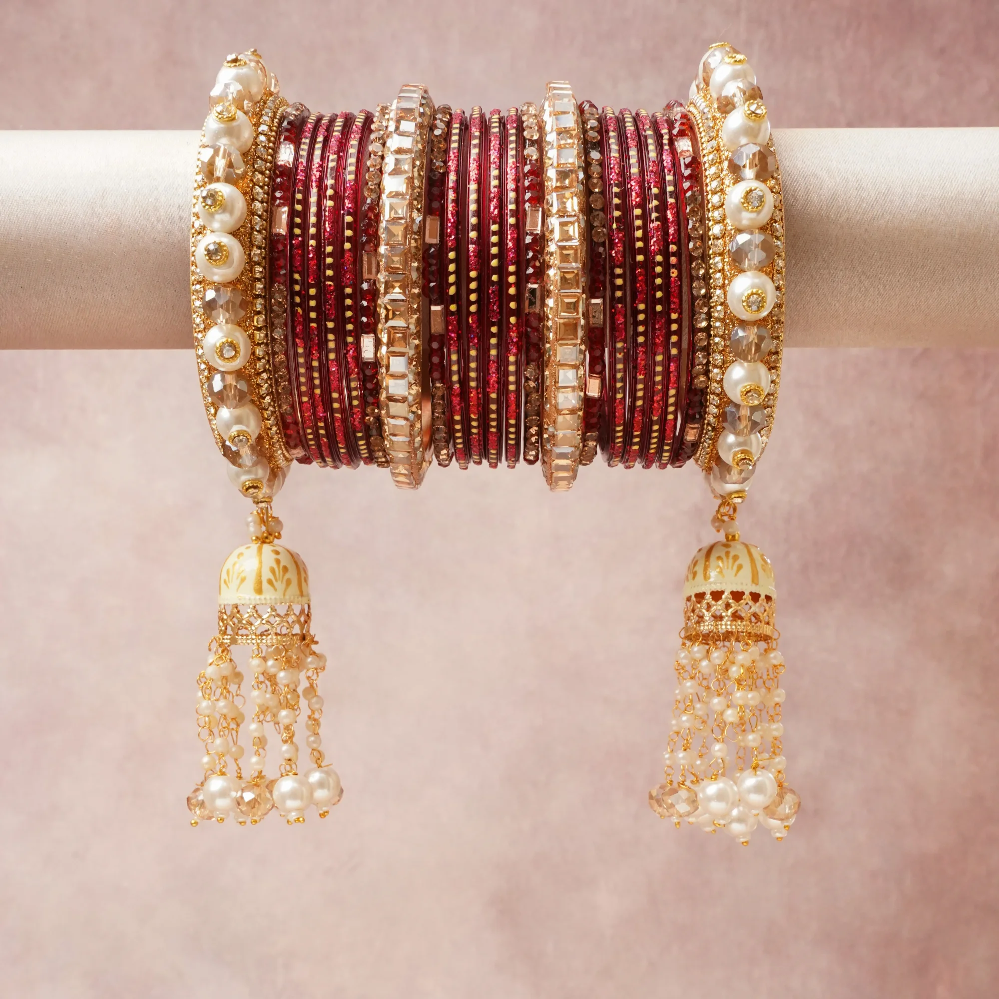 A majestic Burgundy Red set, complemented by Lustrous Pearl White, Champagne Crystal, Antique Gold, Bright Gold Dots featuring Glass Bangles, Gold-Plated Metal Alloy, Faux Pearls, Faceted Crystal Glass, Enamel Paint.
Rich, ceremonial, and designed to be passed through generations.